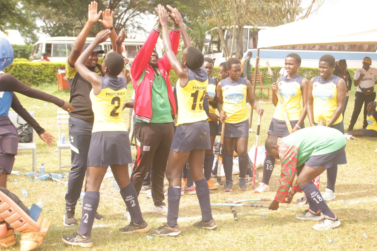 St Joseph's Kitale Girls celebrate with their coaches