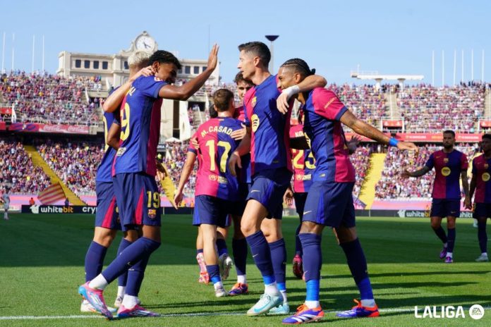 Barcelona players celebrate their La Liga victory after the match.