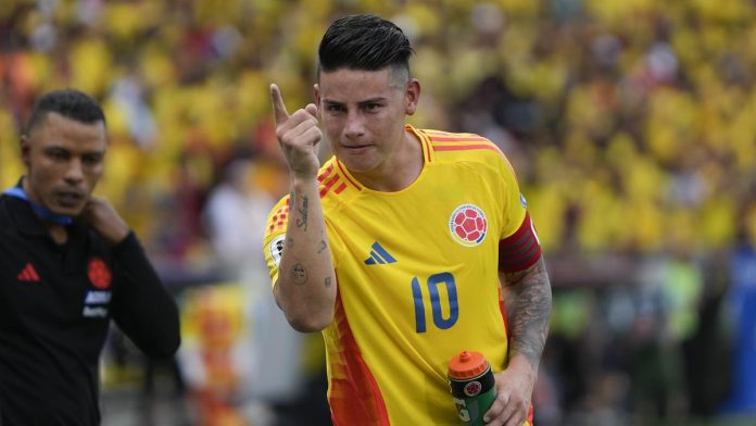 James Rodriguez celebrates after scoring the winning penalty in Colombia's 2-1 win over Argentina