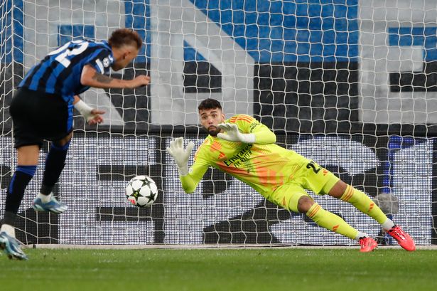 Raya makes a penalty save in Arsenal's Champions League match against Atalanta.