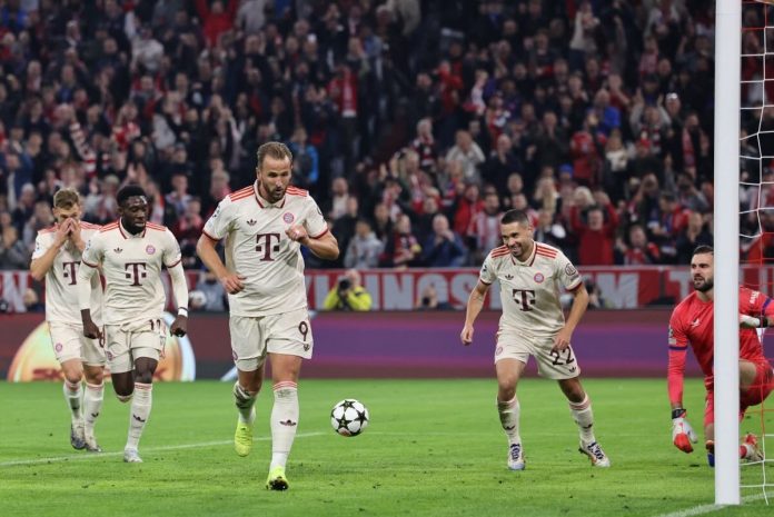 Harry Kane celebrates scoring a goal for Bayern Munich in a Champions League match against Dinamo Zagreb.