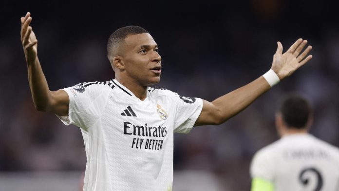 Kylian Mbappé celebrates after scoring his first Champions League goal for Real Madrid in their 3-1 victory over Stuttgart.