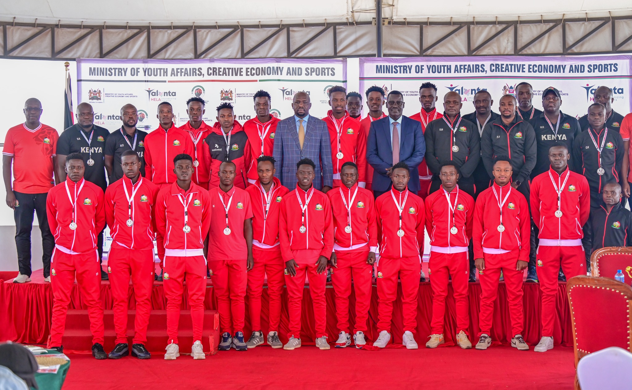 Kenya U-20 men's football team posses for a photo with Cs Murkomen during breakfast with Sports official .They were recognized for their incredible performance and historic qualification for the U-20 AFCON tournament. 