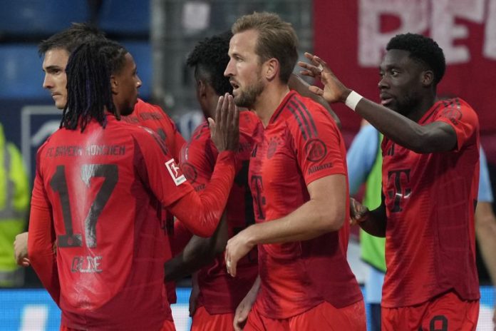 Bayern players celebrate after a goal during the German Bundesliga soccer match between VfL Bochum and Bayern Munich in Bochum, Germany, Sunday, Oct. 27, 2024. (AP Photo/Martin Meissner)