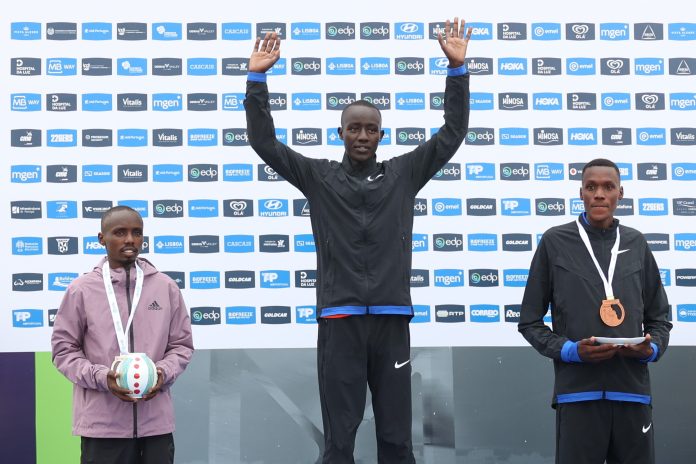 (L-R) Second-placed Emmanuel Kemboi of Kenya, first-placed Wisley Kimeli of Kenya, and thrid-placed Edwin Tuitoek of Kenya pose on the podium of the Lisbon Marathon, in Lisbon, Portugal, 06 October 2024. EPA/ANTONIO PEDRO SANTOS