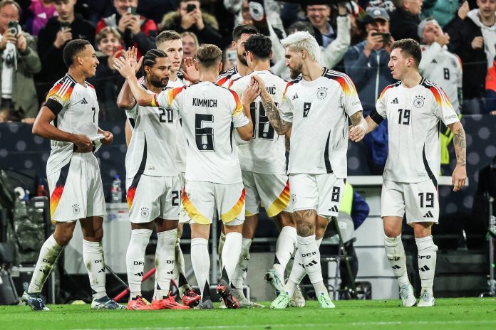 Germany football players celebrating after Jamie Leweling scores the winning goal against the Netherlands in the UEFA Nations League.