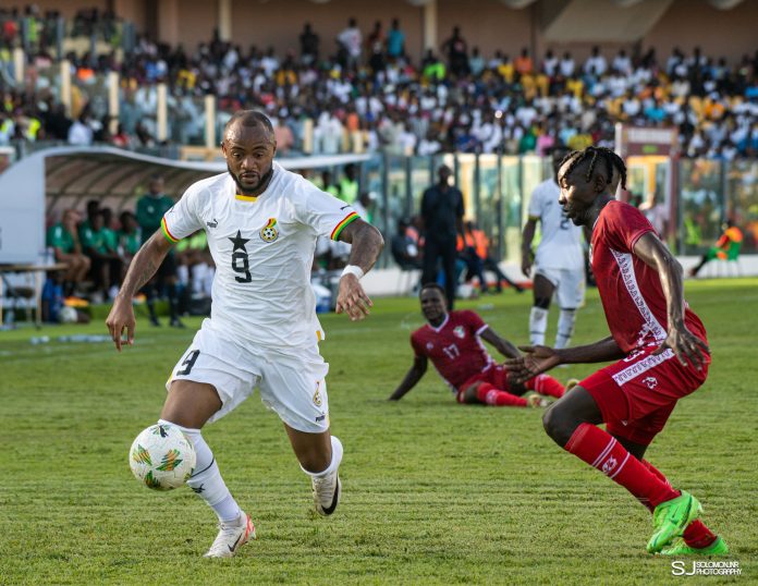 Ghana and Sudan players compete fiercely for possession during their AFCON qualifier clash in Accra