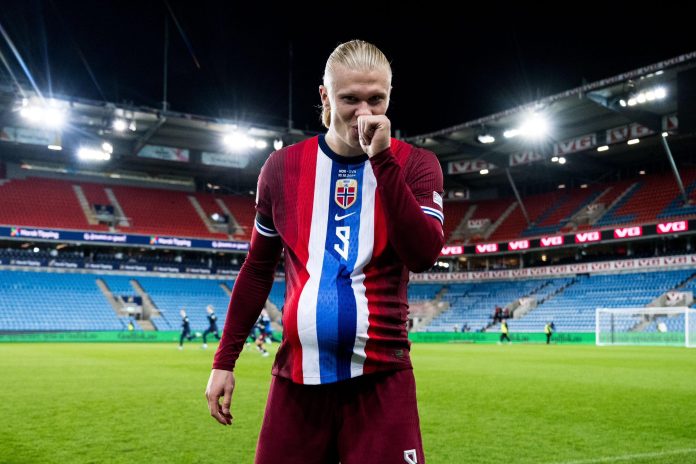 Haaland making a baby bump gesture on the pitch after scoring for Norway