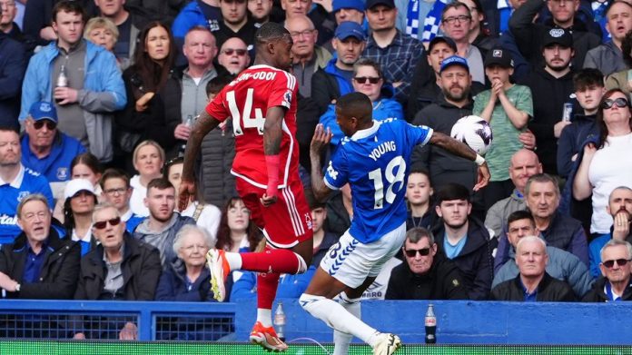 Forest’s Ola Aina challenges Everton’s Ashley Young for the ball during a Premier League match at Goodison Park.