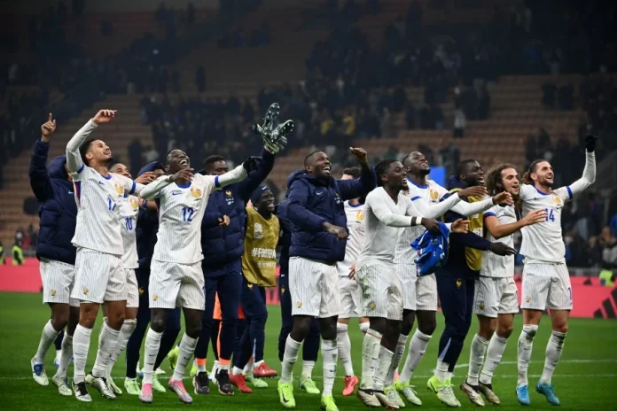 French players celebrate their victory at the end of the Nations League group A2 football match between Italy and France at San Siro stadium in Milan, on November 17, 2024. - AFP PIC