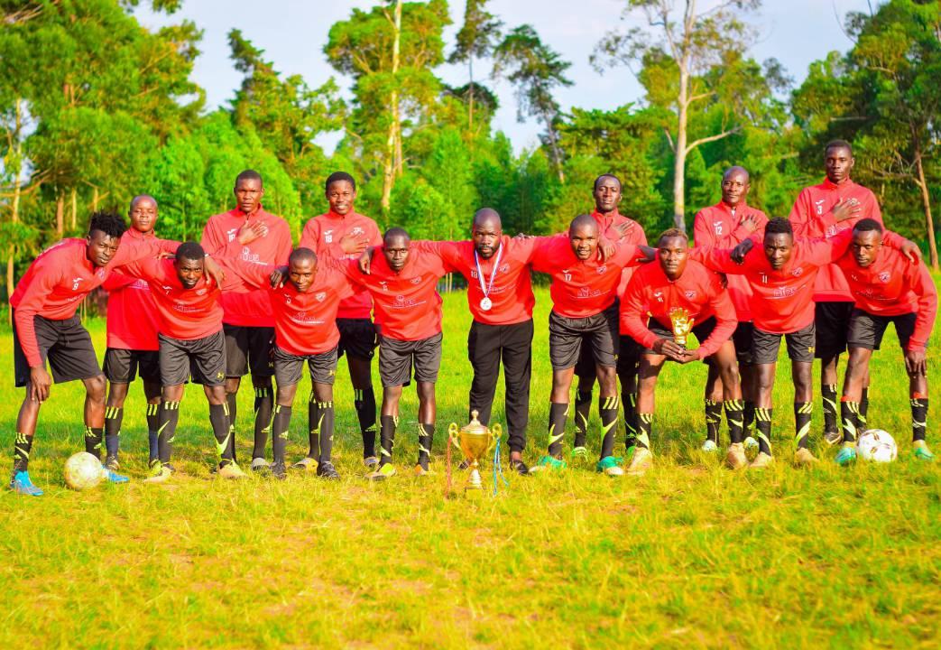 Dol FC players poses for a photo after winning a trophy in a recently concluded tournament