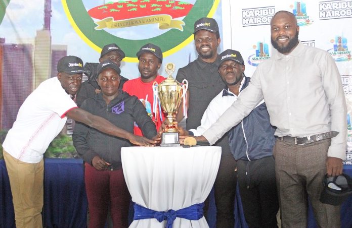 Nairobi International Cup Launch:From Left- FIFA Referees Anthony Ogwayo and Beth Hinga, Gbenga Lein of Obas Sports Management, Obas Sports Management’s Elisha Winga, Lead Scout Coordinator for East and Central Africa and Collins Oliver, Key Accounts Manager at Kenya Airways during the launch of Nairobi International Legacy Cup at Uhuru Sports Complex in Nairobi. PHOTO/ JONAH ONYANGO