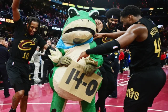 Photo credit Nov 15, 2024; Cleveland, Ohio, USA; Cleveland Cavaliers guard Darius Garland (10) and center Jarrett Allen (31) and guard Donovan Mitchell (45) celebrate with Moondog after the Cavs defeated the Chicago Bulls and moved to 14-0 on the season at Rocket Mortgage FieldHouse. Mandatory Credit: Ken Blaze-Imagn Images