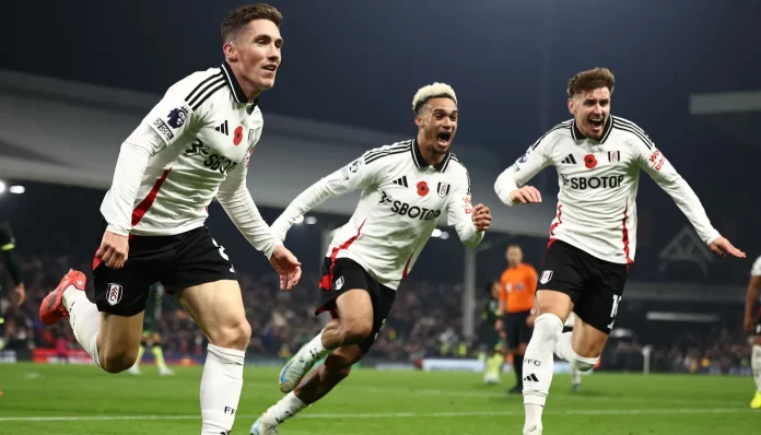 Harry Wilson celebrates with teammates after scoring Fulham’s winner in the 97th minute against Brentford.