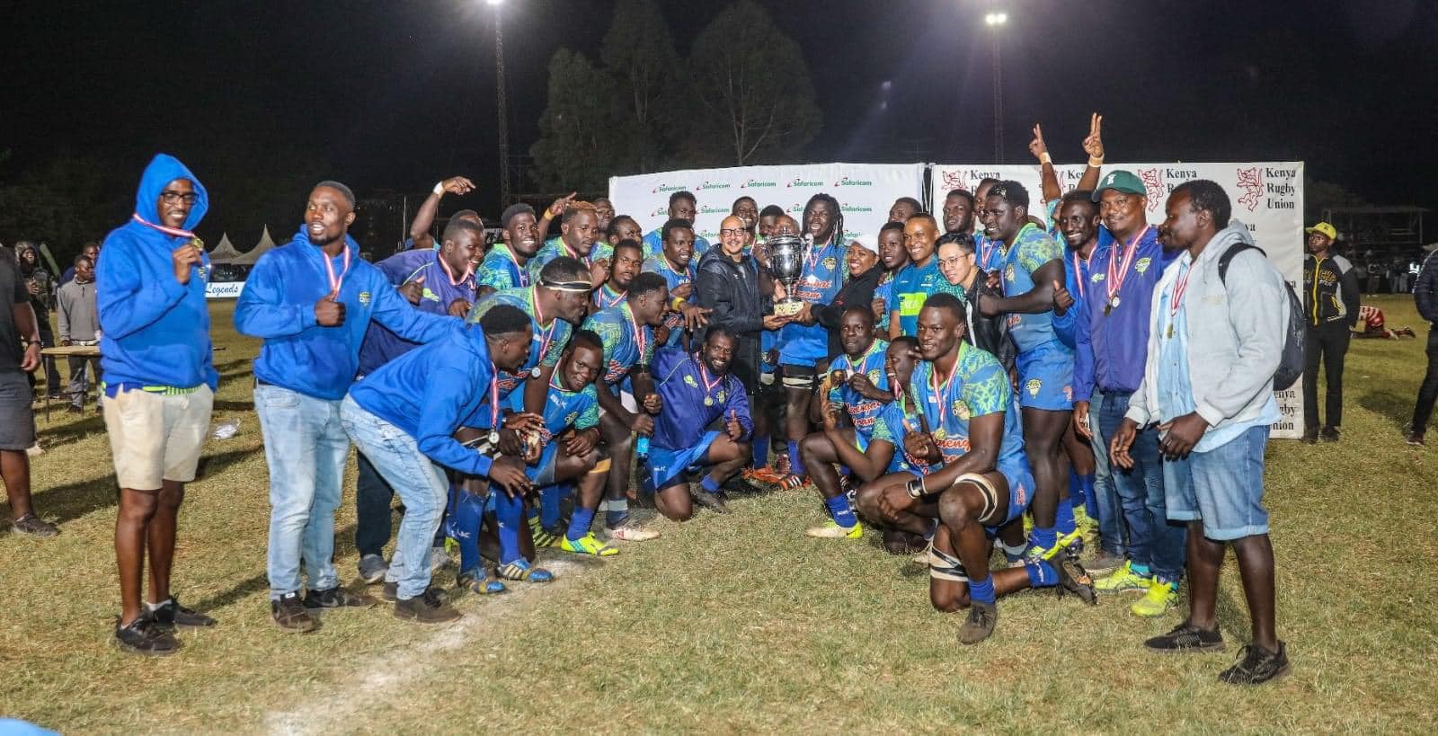 Kenya Rugby Union President Sasha Mutai hands over the Impala Floodlit winners’ trophy to Menengai Oilers captain Ibrahim Ayoo and his teammates on November 2, 2024 at Impala Club in Nairobi.