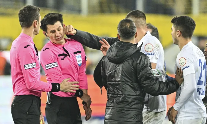 The referee Halil Umut Meler is punched by Faruk Koca, the former president of Turkish Club MKE Ankaragucu, in December 2023. Photograph:AnadoluGetty Images