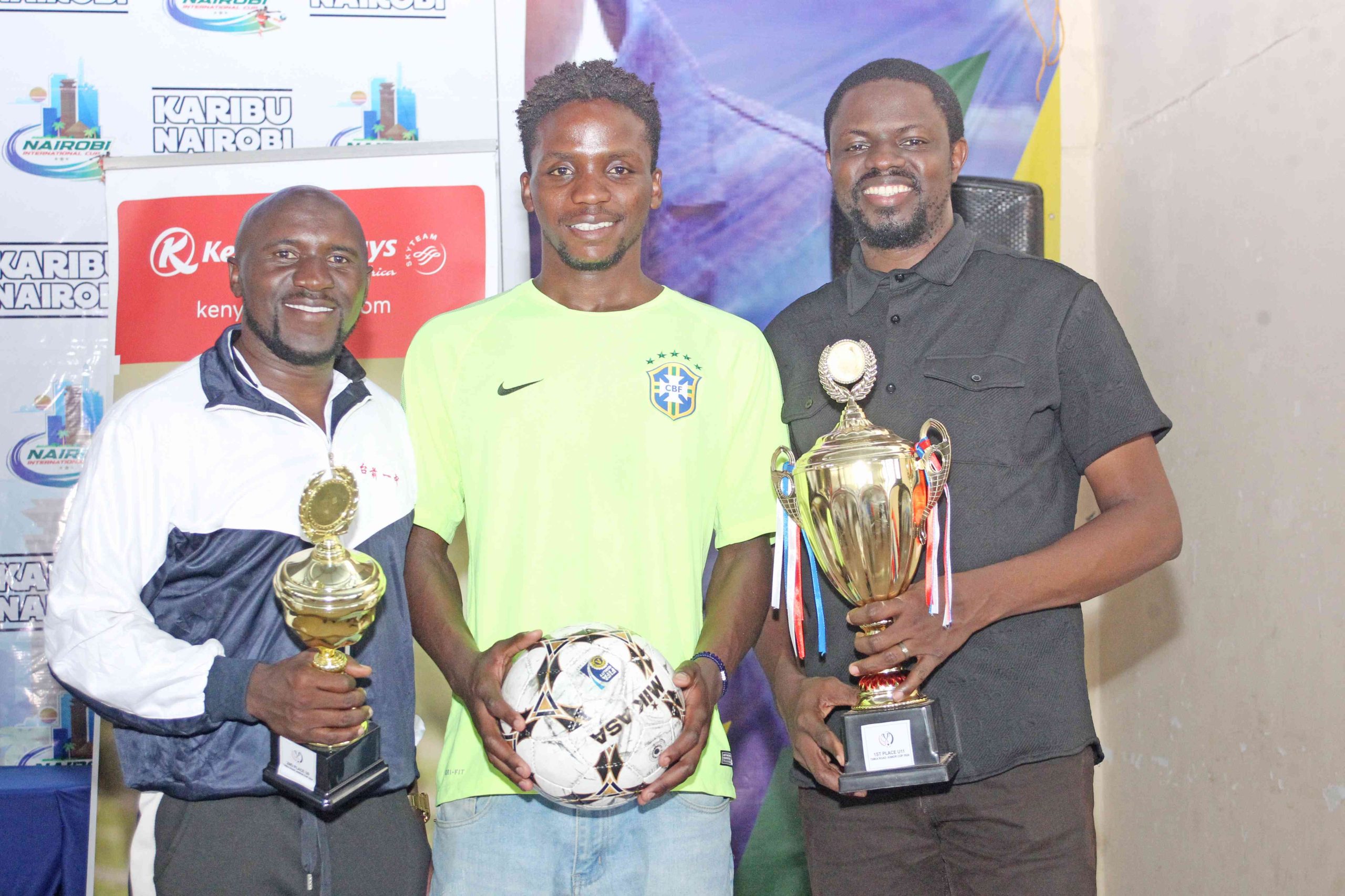 Obas Sports Management's Lead Scout Coordinator for East and Central Africa Elisha Winga, Nairobi City Stars FC central midfielder Zawadi Naftali and Gbenga Lein of Obas Sports Management during the launch of Nairobi International Legacy Cup at Uhuru Sports Complex in Nairobi.