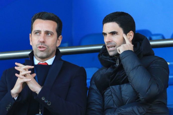 Edu Gaspar and Mikel Arteta in conversation during an Arsenal match.