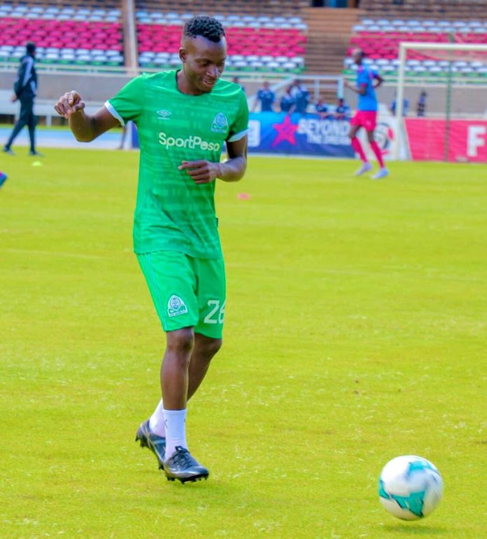 Gor Mahia players, led by captain Philemon Otieno, in a training session on a grassy field, preparing for their upcoming Kenya Premier League matches amidst a challenging season start.