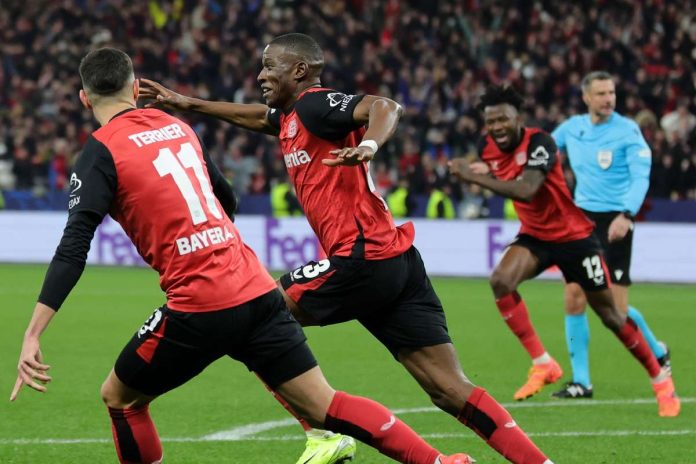 Bayer Leverkusen's Nordi Mukiele celebrates his late winner against Inter