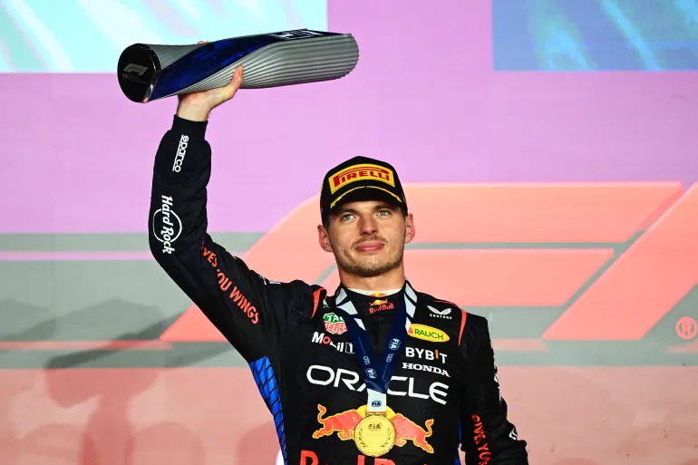 Race winner Max Verstappen of the Netherlands and Oracle Red Bull Racing celebrates on the podium during the F1 Grand Prix of Qatar at Lusail International Circuit on December 1, 2024, in Lusail City, Qatar [Clive Mason/Getty Images]