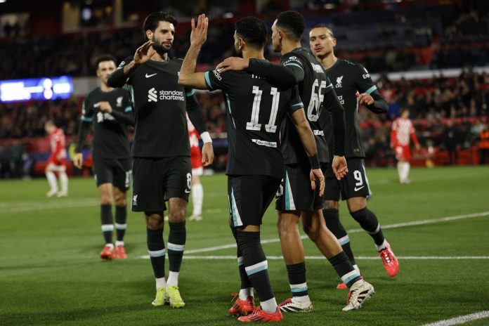 Liverpool's Mohamed Salah celebrates with teammates after scoring a penalty against Girona at the Montilivi Stadium. Salah spot kick was enough to keep Liverpool perfect in Champions League winning 6/6