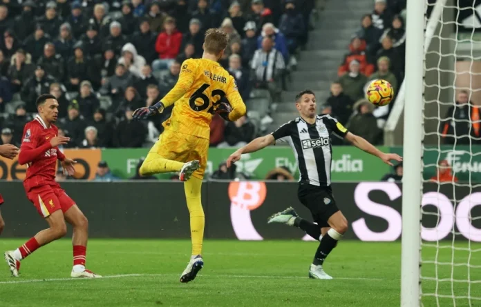 Newcastle United’s Fabian Schar (right) scores their third goal against Liverpool during Wednesday’s Premier League match at St James’ Park in Newcastle. - REUTERS PIC