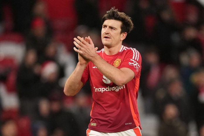 Harry Maguire has had his contract extended by another year at Manchester United (Martin Rickett/PA)