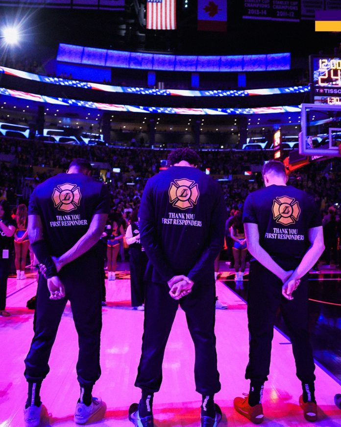 A member of the Los Angeles Lakers wears a shirt thanking first responders battling the wildfires prior to a game against the San Antonio Spurs Katelyn Mulcahy / Getty Images via AFP