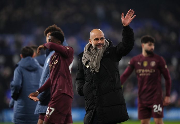 Manchester City manager Pep Guardiola salutes fans after their big win at Ipswich Town (Image: PA)