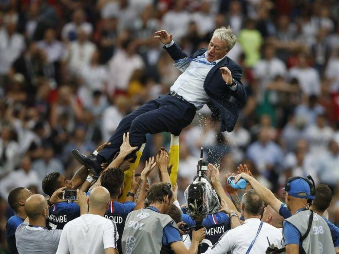 Players throw coach Didier Deschamps into the air after France won the 2018 World Cup final. Photo: AP PHOTO