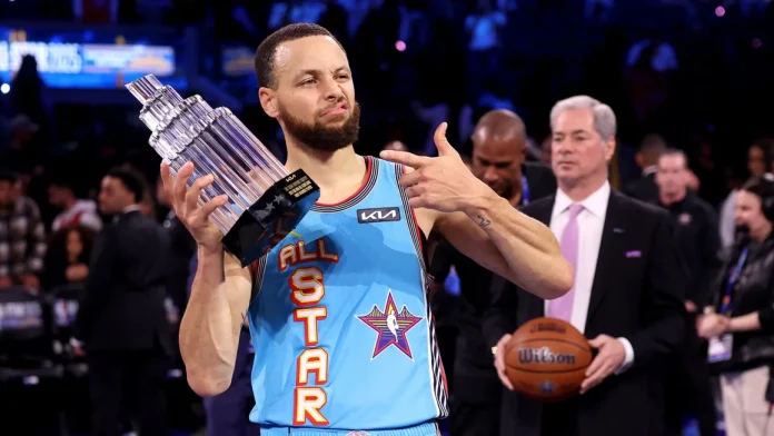 Golden State Warriors guard Stephen Curry poses with the 2025 KIA Kobe Bryant MVP trophy after leading Shaq's OGs to a win during the 74th NBA All-Star Game. Ezra Shaw/Getty Images