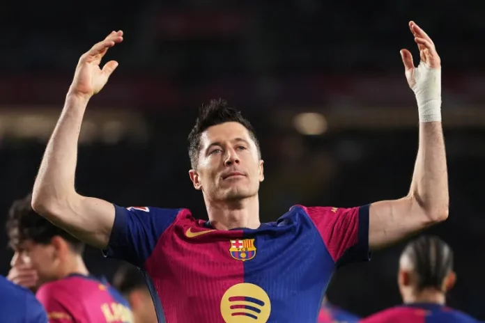 Robert Lewandowski of Barcelona celebrates scoring from the penalty spot against Rayo Vallecano [Alex Caparros/Getty Images]