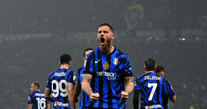 Inter Milan's Marko Arnautovic celebrates after scoring his side's opening goal during an Italian Cup quarter final soccer match between Inter Milan and Lazio, at the San Siro stadium in Milan, Italy, Tuesday, Feb. 25, 2025. Credit: AP/Luca Bruno