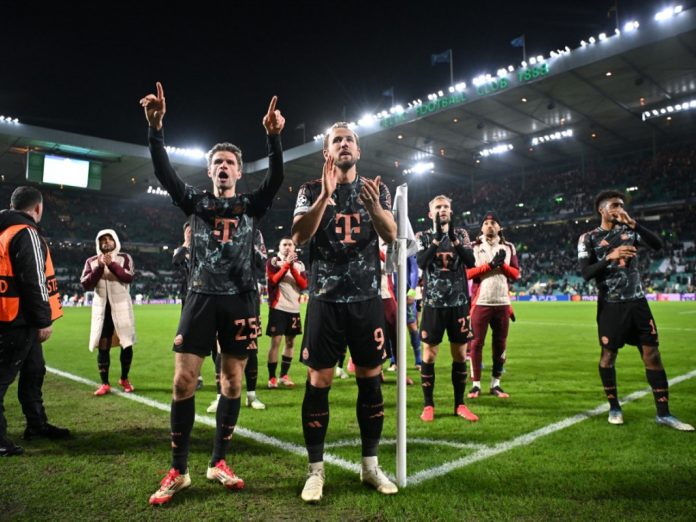 Harry Kane and teammates applause travelling Bayern Fans after their win at Celtic Park