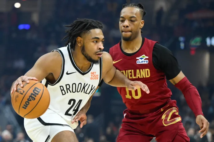 am Thomas looks to make a move on Darius Garland during the Nets’ loss to the Cavaliers. David Richard-Imagn Images