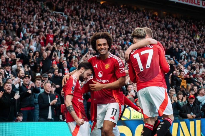 Manchester United Captain Bruno Fernandez celebrates with teammates after scoring direct from a free kick during Sunday draw with Arsenal