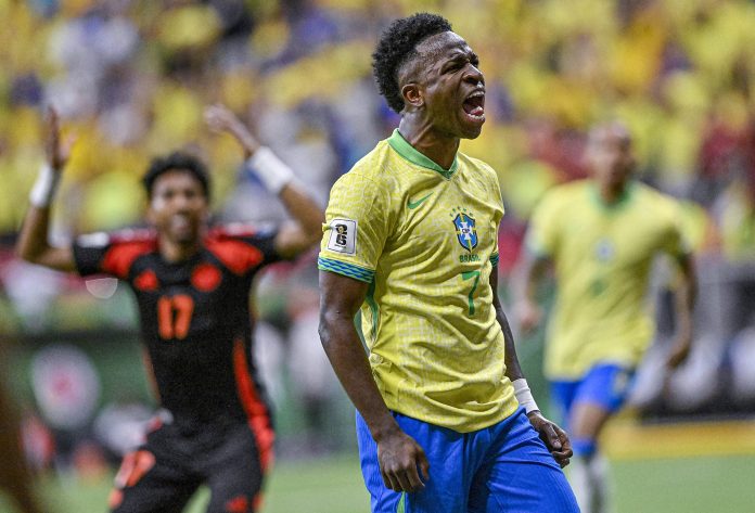 Vinícius Júnior celebrates scoring at the death to gave Brazil victory over Colombia in World Cup qualifying. Photograph: Ueslei Marcelino/Reuters