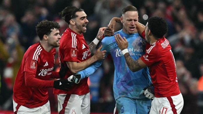 Forest Goalkeeper Matz Sels celebrates with team mates after penalty shootout victory:PAUL ELLIS / AFP / Getty