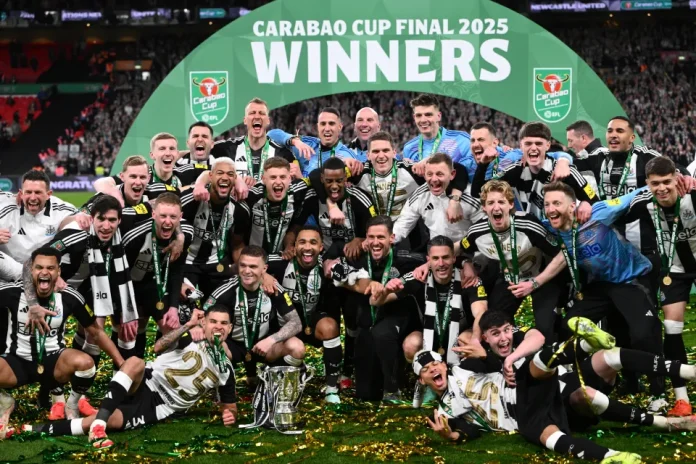 Players of Newcastle United pose for a photo with the Carabao Cup trophy (Image: 2025 Getty Images)