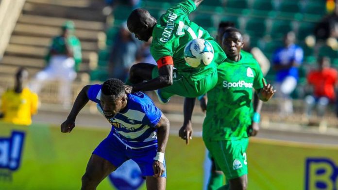 Gor Mahia captain leaps over an AFC Leopards defender in a heated moment during a past Mashemeji Derby clash at a packed stadium