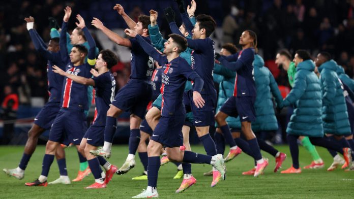 Players from Paris Saint-Germain celebrate with their fans at the Parc des Princes after a 3-1 victory over second-placed Marseille took them 19 points clear at the top of Ligue 1 with eight games of the season remaining. AFP - FRANCK FIFE