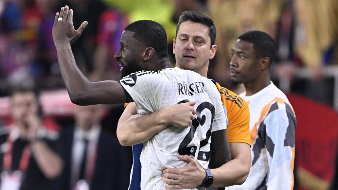 Antonio Rüdigerr had to be held back by Real coaching staff after being sent off- Getty Images