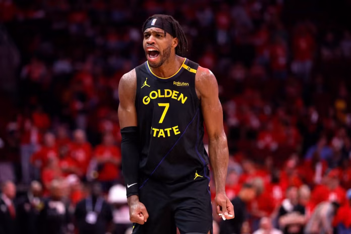 Buddy Hield of the Golden State Warriors reacts against the Houston Rockets after making a three-point basket-Tim Warner / GETTY IMAGES