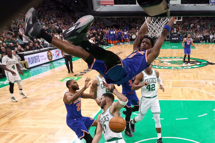 New York Knicks' OG Anunoby dunking on Celtics guard Jayson Tatum in Game 1 of the 2025 NBA Playoffs Eastern Conference semi-finals.-Maddie Meyer/Getty Images/AFP
