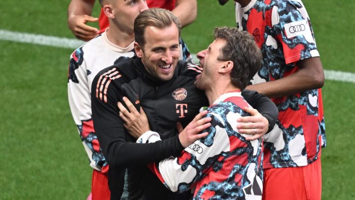CHAMPIONS: Bayern Munich's Harry Kane and Thomas Muller celebrate. Pic: PA Wire.