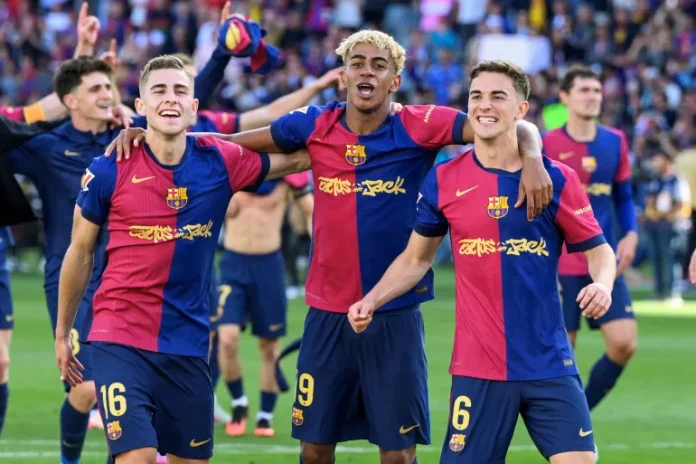 From left, Barcelona's Fermin Lopez, Lamine Yamal and Pablo Gavi celebrate victory at the end of the Spanish league match against Real Madrid [Josep Lago/AFP]