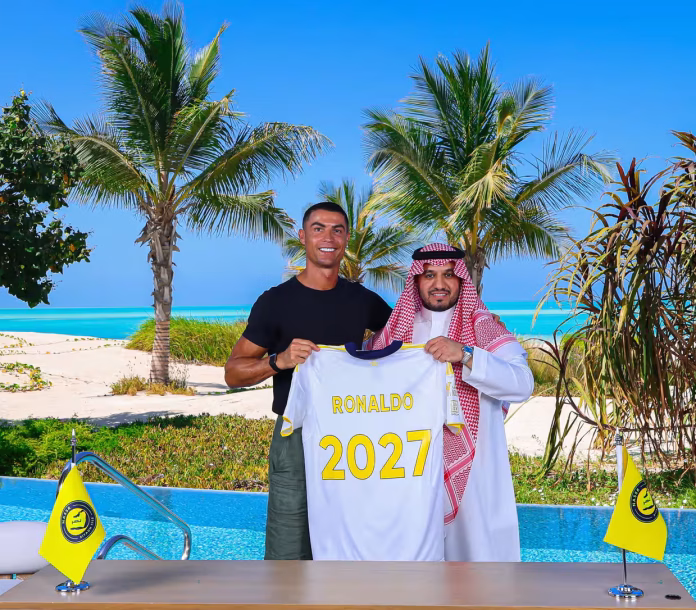 Cristiano Ronaldo poses with the Al-Nassr chair, Abdullah al-Majid, after signing a new deal with the Saudi club. Photograph: Al Nassr Football Club/AFP/Getty Images