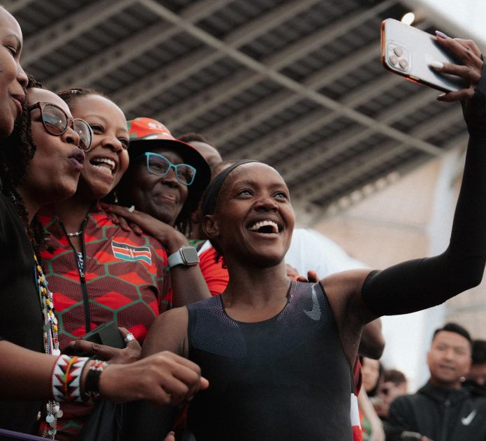 Faith Kipyegon, in a black skinsuit, bettered her own world record time but could not dip under four minutes: Photo credits: Photo Courtesy