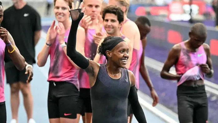 Faith Kipyegon, in a black skinsuit, bettered her own world record time but could not dip under four minutes